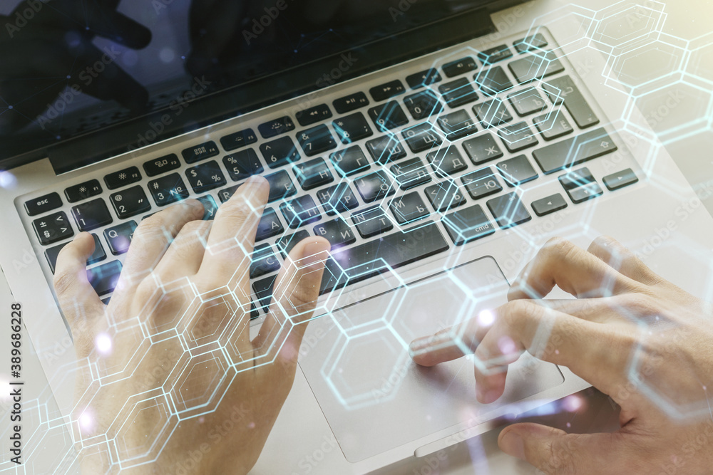 Aufkleber creative concept of wireless technology with hexagon hologram and hands typing on laptop on backgrou