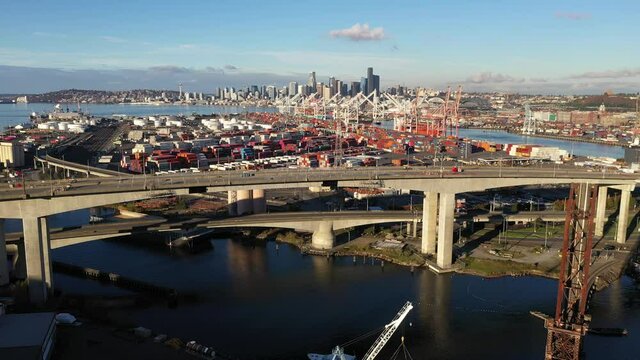 Aerial / drone footage of West Seattle, the West Seattle bridge, Harbor Island, Duwamish Waterway, Seattle Harbor terminals, Elliott Bay in Seattle, King County, Washington