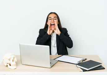 Young traumatologist asian woman isolated on white background shouting excited to front.