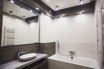 Fototapeta na wymiar Modern bathroom in white and gray tones with mosaic on wide angle view