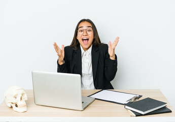 Young traumatologist asian woman isolated on white background celebrating a victory or success, he is surprised and shocked.