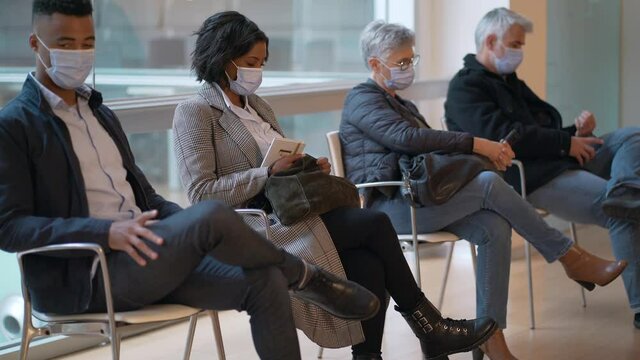 Patients sitting in waiting room with mask, COVID-19 pandemic