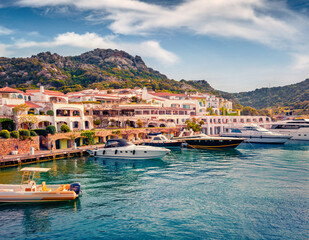 Adorable summer view of Poltu Quatu port with luxury yacht and motorboat. Stunning morning scene of...