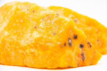A Rotten pieces of pumpkin. Rotten vegetable and spoiled food. A product that has been affected by mold isolated on the white background.
