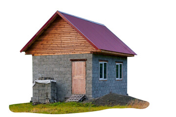 A small one-story house under construction from cinder blocks with a metal roof isolate on a white background.