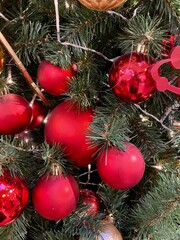 Beautiful Christmas tree with decor as a background.  Christmas tree decorated with red balls.