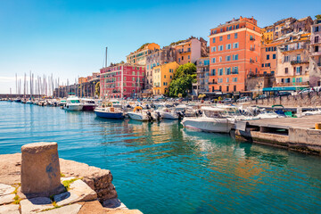 Colorful houses on the shore of Bastia port. Bright morning view of Corsica island, France, Europe. Magnificent Mediterranean seascape with yacht. Traveling concept background. - obrazy, fototapety, plakaty