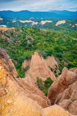 Sunset landscape of the Melnik Pyramids near the village of Rozhen, Southwest Bulgaria. Sand pyramids in the Pirin Mountains, view from Rozhen - Melnik hiking trail