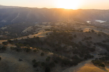 The last light of day shines on the rolling hills in Northern California. These beautiful, golden hills turn green once winter brings seasonal rain to the region.