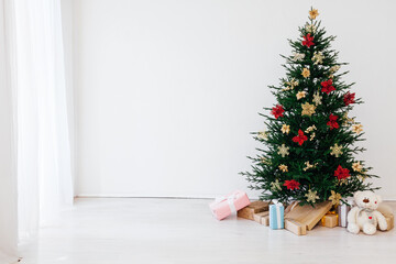 Christmas tree pine with gifts for the new year decor interior red white