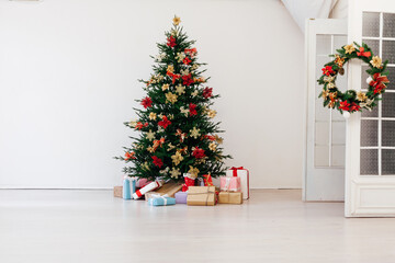 Garland Christmas tree pine with gifts for the new year decor interior red white