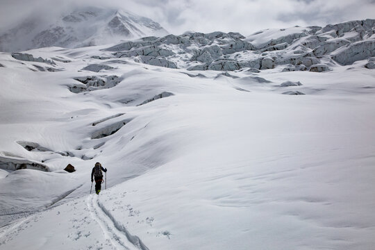 person ski touring in the swiss alps