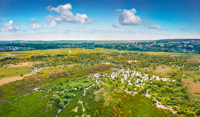 Fototapeta na wymiar Aerial summer view of flooded valley. Picturesque landscape of snake shape Seret river. Fresh green scene of Ternopil countryside, Ukraine. View from flying drone. Traveling concept background..