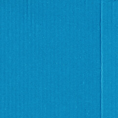 A blue vintage rough sheet of carton. Recycled environmentally friendly cardboard paper texture. Simple minimalist papercraft background.