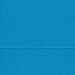 Obraz premium A blue vintage rough sheet of carton. Recycled environmentally friendly cardboard paper texture. Simple minimalist papercraft background.