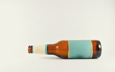 a bottle of beer with a light blue label on a white background
