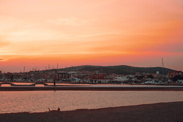 Sunset in Croatia. Evening city of Vodice. The sun sets into the sea.