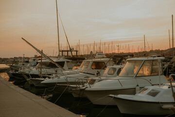 Fototapeta premium There are many yachts, boats and ships at sea. Marina at sunset.