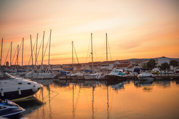 Fototapeta na wymiar There are many yachts, boats and ships at sea. Marina at sunset. Vosice Croatia Gorgeous summer sunset by the ocean