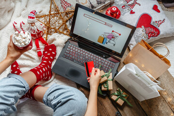 Christmas holidays, online shopping at home and lockdown coronavirus.Christmas online shopping, black friday sale and discounts promotions during the Xmas.