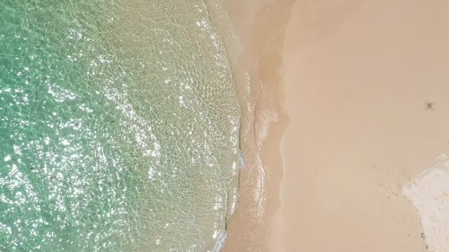 Clear water white sand beach aerial top shot Martinique Sainte Anne les Salines beach 