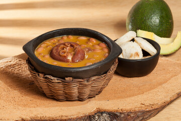 Bean soup with pork hoof; Latin American or Mexican cuisine.