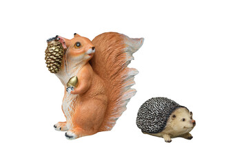 Plaster classical garden figure. Isolated over white background. Set Hedgehog and squirrel with golden forest cones. Blank for the designer.