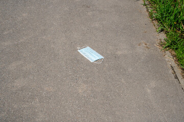 dirty mask on the asphalt