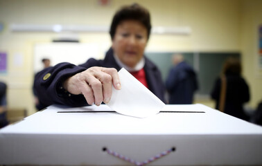 Woman casts his ballot at elections