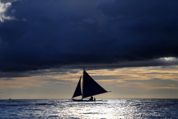Small sailing boats at the sunset. Boracay, Philippines