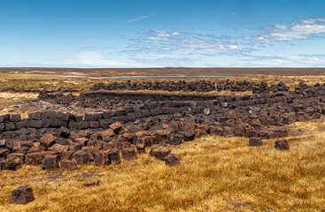 Falkland Islands, UK - December 15, 2008: Wide windswept bare landscape of dry land with a peat...