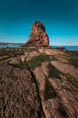 Rocky beach next to the famous twin rocks of Hendaia at the Basque Country's coast.