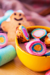 cup of chocolte with marshmallows and gingerbread man and gingerbread cookie on bokeh background. Christmas banner.