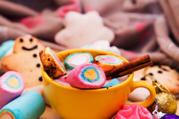 cup of chocolte with marshmallows and gingerbread man and gingerbread cookie on bokeh background. Christmas banner.