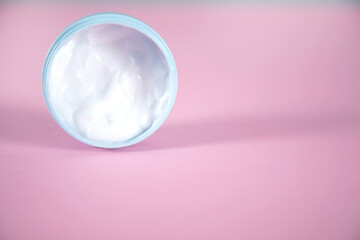 face cream on the pink table