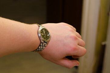 Silver watch on a man's hand