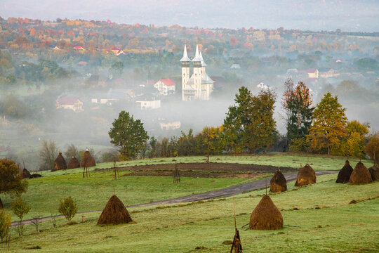 breb maramures in autumn fog traditional Romanian village
