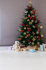 Christmas tree decor with gifts for the new year interior