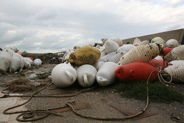 Buoys and ropes in the port - 389711844