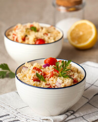 Tabouleh is an Arabic vegetarian salad made with couscous, tomatoes, parsley. Healthy lunch
