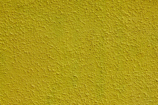 Close Up Texture Of Yellow Concrete Wall Or Plaster.