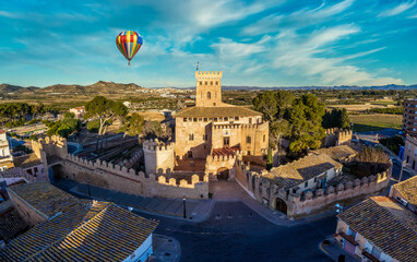 Aerial view of historic Benisano castle near Valencia Spain with loopholes, towers, walls colorful...