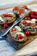 Open sandwiches of rye bread with homemade pate. Rustic style.