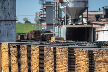 Stacks of wooden boards in a cooperage or barrel factory.