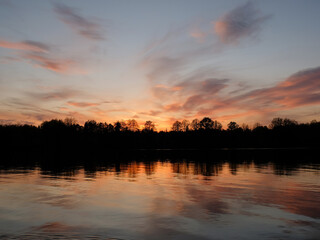 Beautiful sunset reflected in water of lake