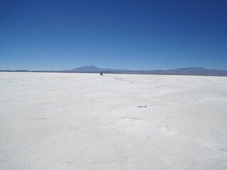 Sunset over the stunning salt flats, desert and mountain landscapes around Salar de Uyuni in Bolivia, South America
