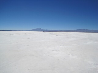 Sunset over the stunning salt flats, desert and mountain landscapes around Salar de Uyuni in Bolivia, South America