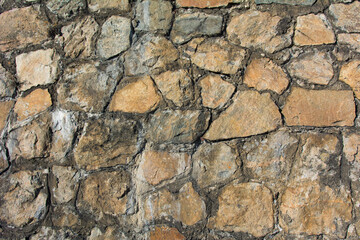 Light yellow masonry made of natural stone.