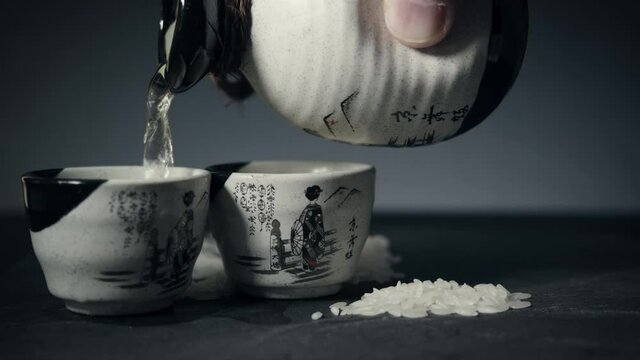 Pouring Sake with Sake Cup and Sake Bottle