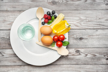 Interval fasting diet concept represented with a plate and products - obrazy, fototapety, plakaty